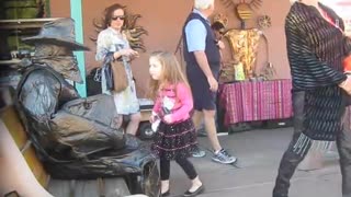 Living Statue Spooks Woman and Child