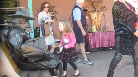 Living Statue Spooks Woman and Child