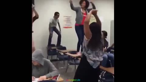 Girl Gets Pushed Off The Desk. Totally Deserved it.