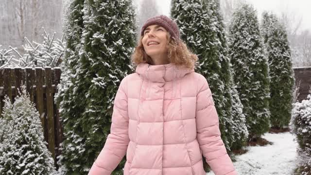 Cute Girl enjoy Holidays on Christmas Snowfall Holidays FUN