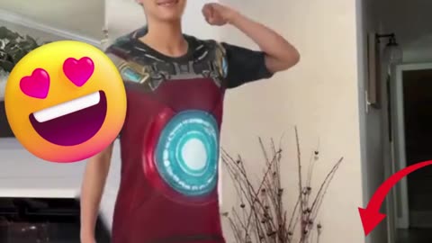 Power Moves! 💥 Young Woman Rocks Iron-Inspired Armor Shirt!