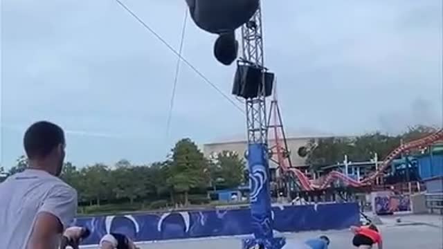 Man Makes Impressive Frontflip Below Person Displaying Backflip While Jumping On See Saw