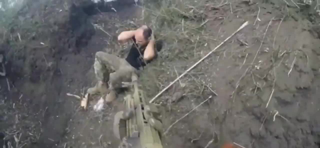 Donetsk People's Republic soldiers clear enemy trenches