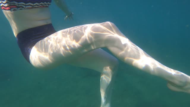 beautiful woman swimming in the sea