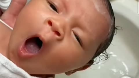 cute baby taking a bath