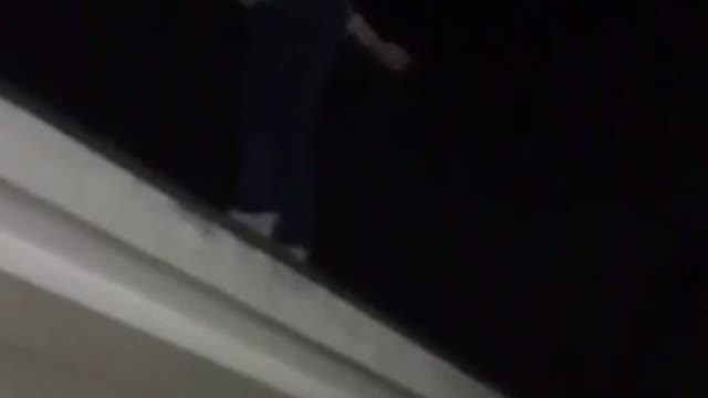 Backflip off a roof blue shirt