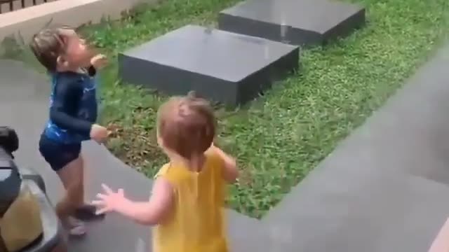 Babies playing in the rain for the first time in their lives