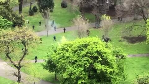 Overhead View of Cops Opening Fire On Australian Protesters For Not Obeying