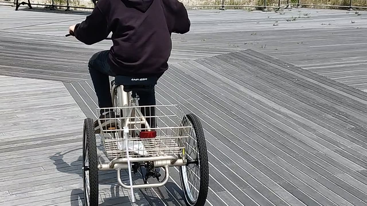 Spencer riding his tricycle at Jones beach air show VID_20230521_132314