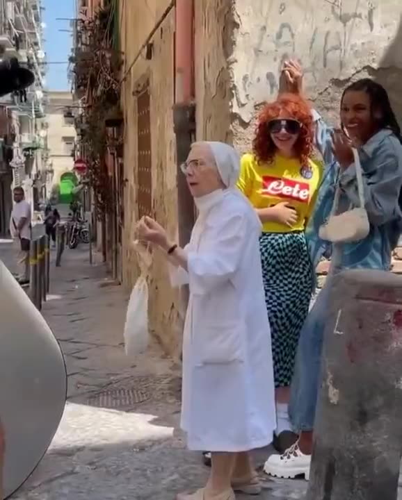 Nun pulls apart girls kissing during photo shoot in Italy