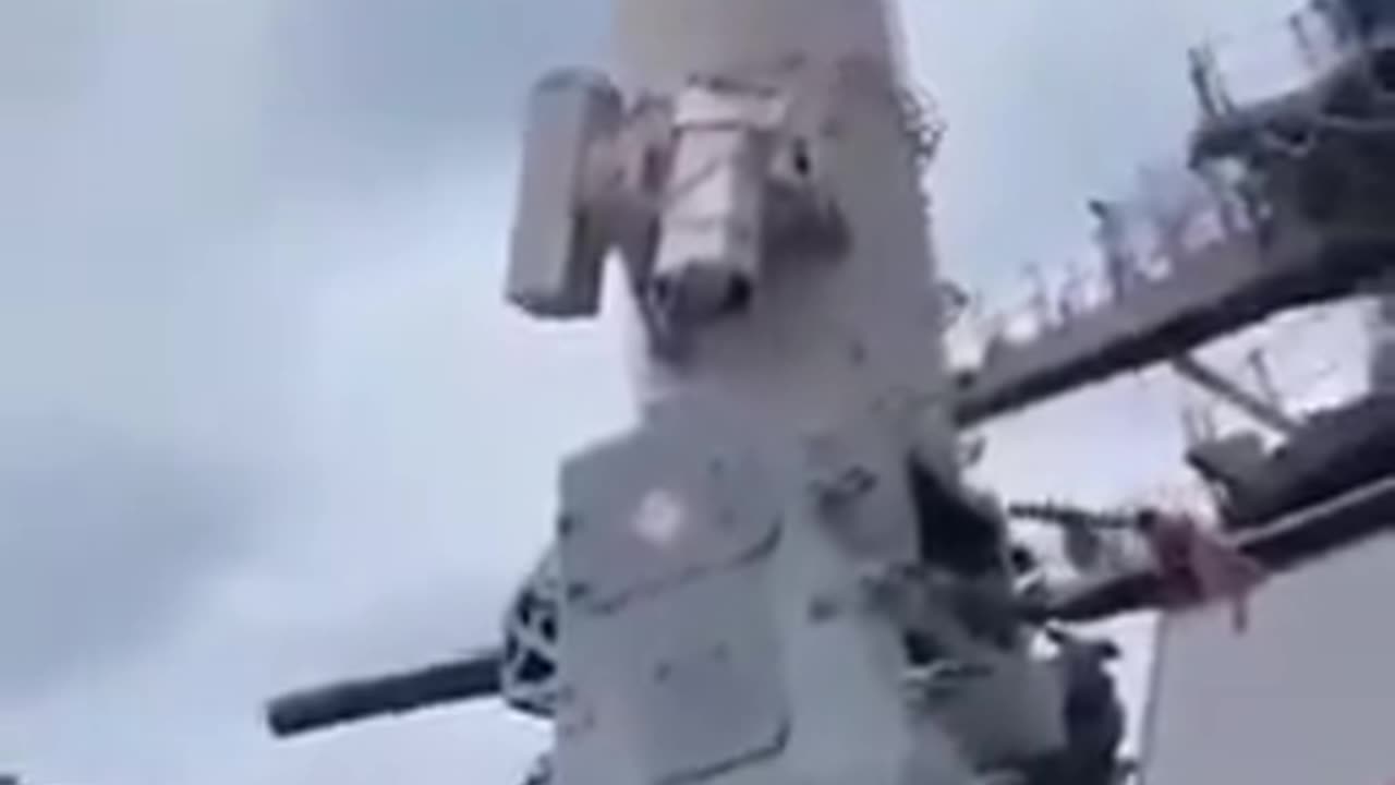 A close-in weapon system detects a passenger plane going overhead