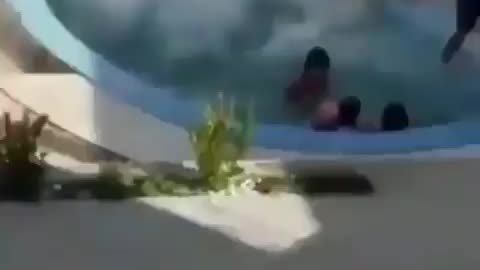 Huge person throwing himself in the pool