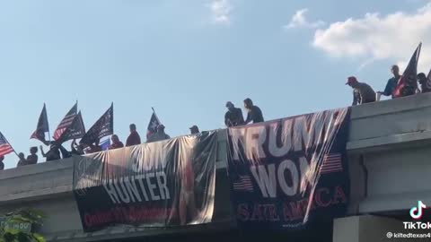 🤣 Trump Won banner on Texas overpass next to My Son Hunter banner.