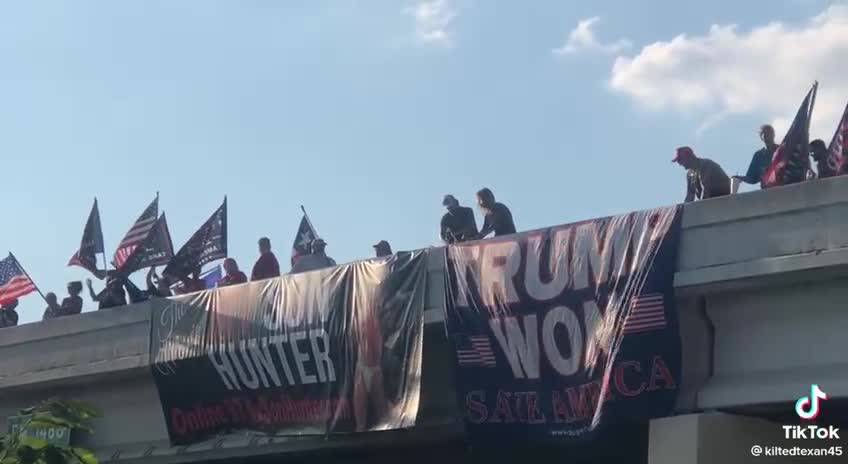 🤣 Trump Won banner on Texas overpass next to My Son Hunter banner.