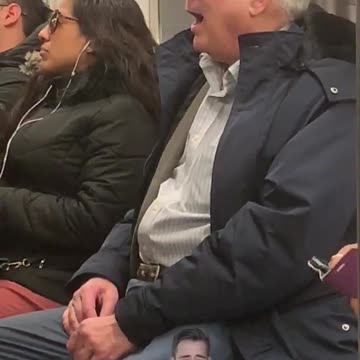 Old man on subway train sings opera out loud