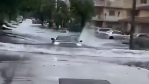 Car repair driver driving across stagnant water road