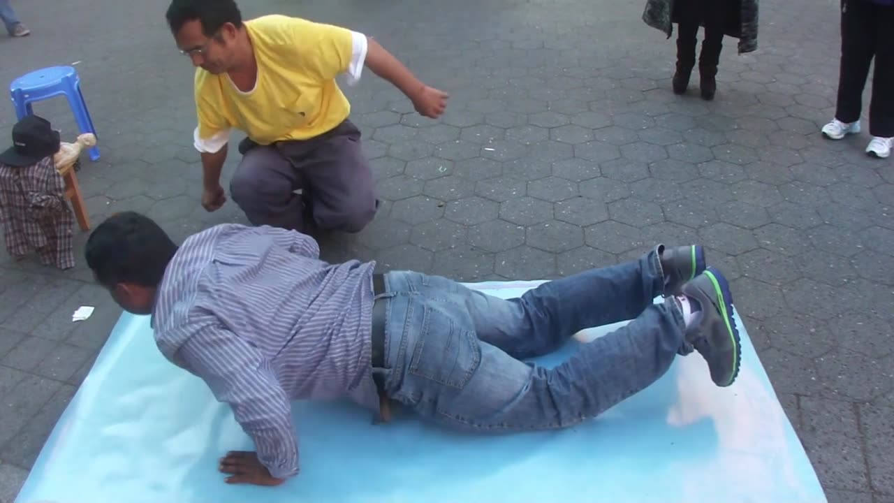 Luodong Massages Indian Man On Sidewalk