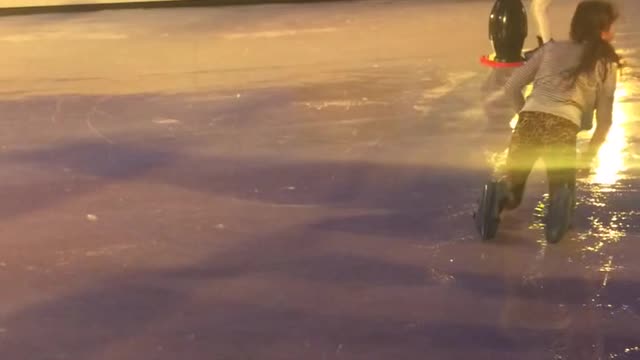 Camo pants ice skating girls faceplants on rink