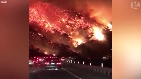 Commuter drives through raging wildfire in California – dashcam video