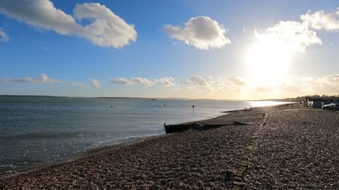 Sun is setting at the beach.