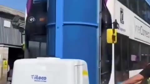 Portable machine used to clean a double decker bus