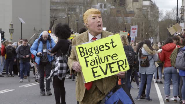 Climate Protestor in Trump Mask