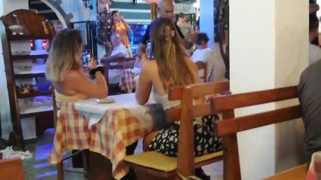 Greek waiters dancing with glass on their head