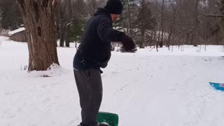 Snow boarding on a sled