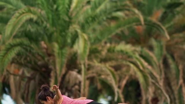 An elderly woman doing yoga