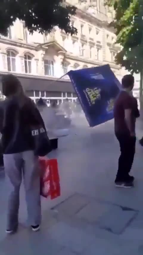 England, Liverpool an Islamic stall is attacked by rioters