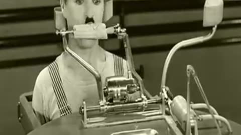 Charles chaplin with feeding machine