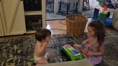 CUTE! Baby dances to older sisters "music".