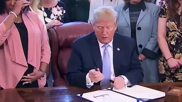 Woman who sued Backpage.com dances as Trump signs bill combatting online sex trafficking