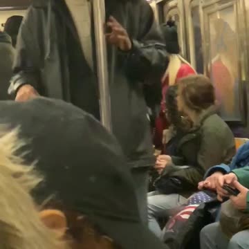 Three men sing gospel music on subway train