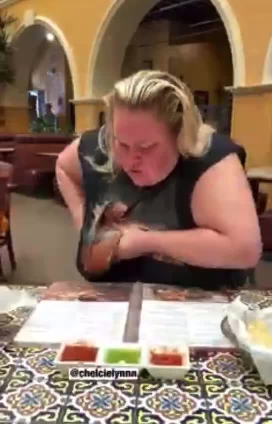 Woman eating nachos crushing a cockroach with her boob WTF !