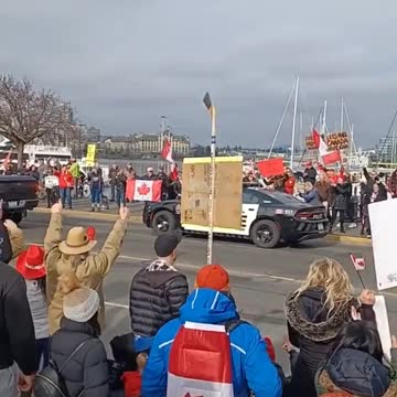 Ottawa Officer Gives a Thumbs up to Protesters