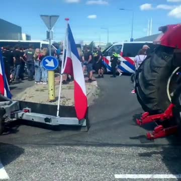 Dutch farmers convoy blockades distribution centers and supermarkets to protest farm closures