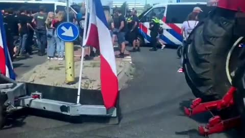 Dutch farmers convoy blockades distribution centers and supermarkets to protest farm closures