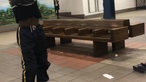 Guy does drag dance in subway station, wig flies off