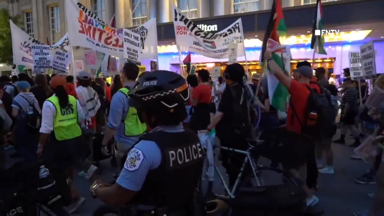 Hundreds of DNC protesters are now gathered outside a Hilton hotel where delegates are thought to be staying.