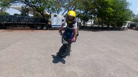 PROFESSIONAL DOING STUNTS ON A MOTORCYCLE