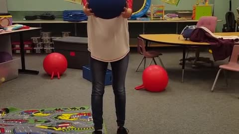 Classroom bottle on ball hit camera