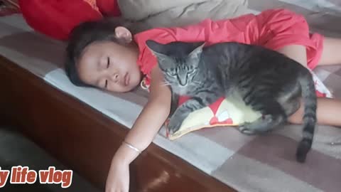 thorny baby hugs a sleeping cat