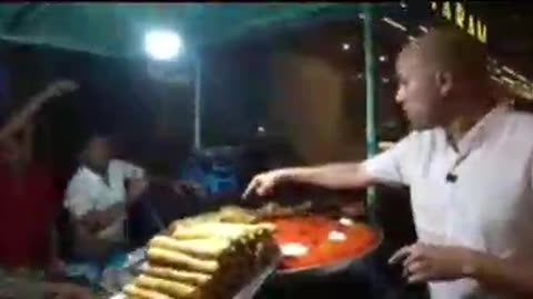 Street food sweet halwa Puri sweet semolina made with sugar syrup dry fruits with fried Paratha