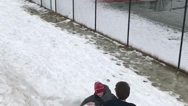 Boy in red beanie back flip fail in snow