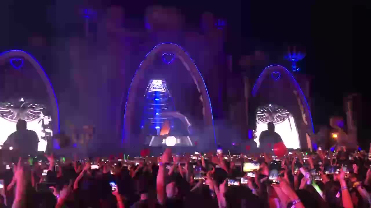 crowded EDM party with fireworks