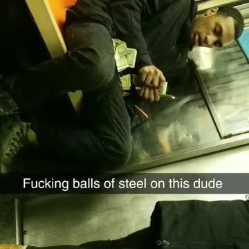 Guy counting wads of money on subway