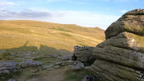 Climbing up to touch the granite cross. Brat Tor Dartmoor