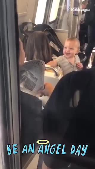 Man subway peek-a-boo baby newspaper train