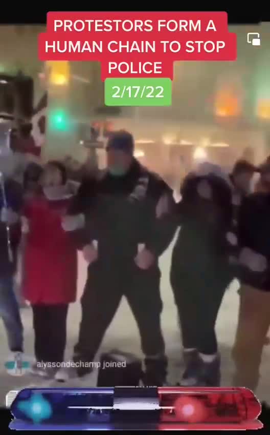 Canada - Protestors form Human Chain to Block off Police